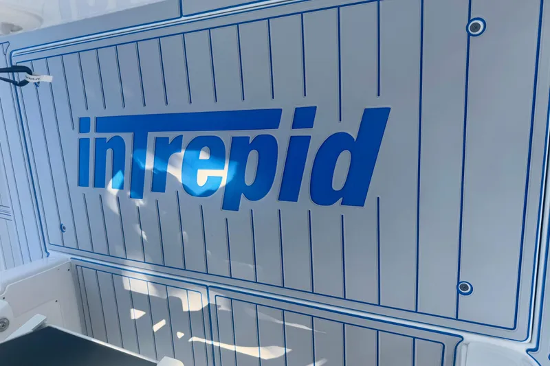 Slide: The Image of Interior view of 2025 Intrepid 43 Nomad SE boat, featuring sleek design and wooden flooring. - 48