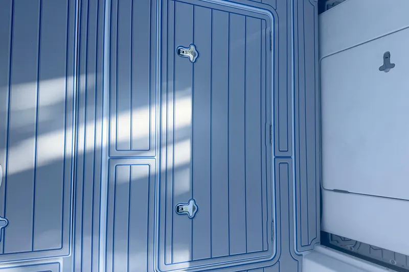 Slide: The Image of Intrepid 43 Nomad SE 2025 boat logo on deck with blue lettering. - 50