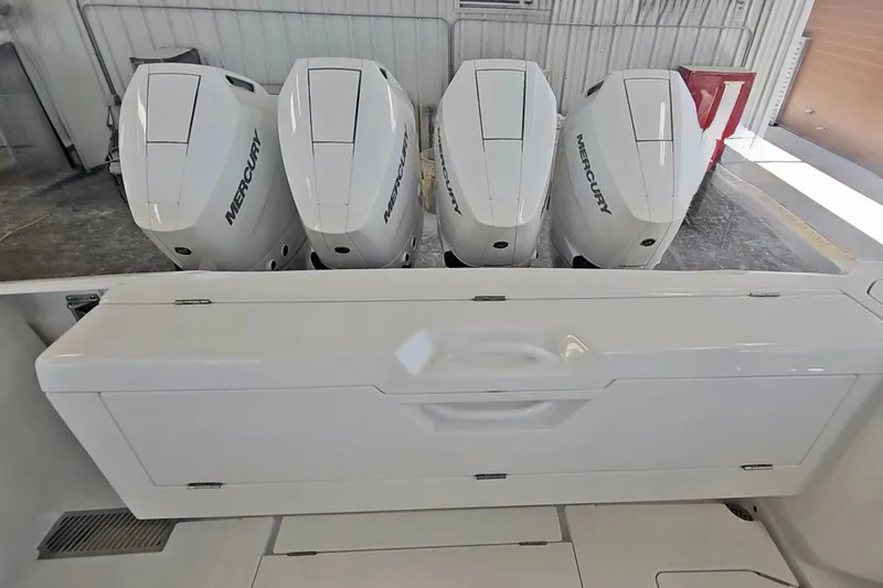 Slide: The Image of 2025 Intrepid 43 Nomad SE boat on clear blue water under a sunny sky. - 6