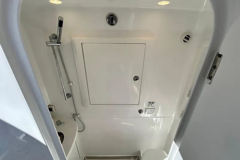 Slide: The Image of 2025 Intrepid 43 Nomad SE boat bathroom with modern fixtures and sleek design. - 63