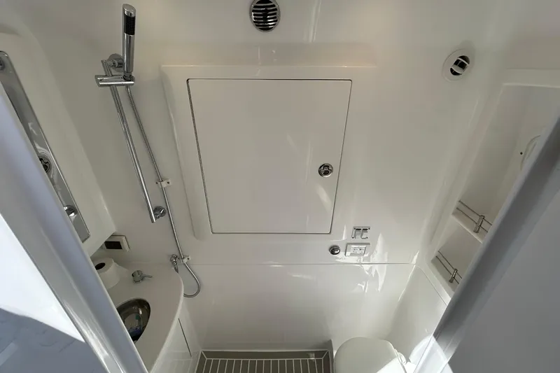 Slide: The Image of 2025 Intrepid 43 Nomad SE boat bathroom with modern fixtures and sleek design. - 64