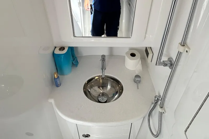 Slide: The Image of Compact bathroom in 2025 Intrepid 43 Nomad SE with sink, mirror, and shower. - 66