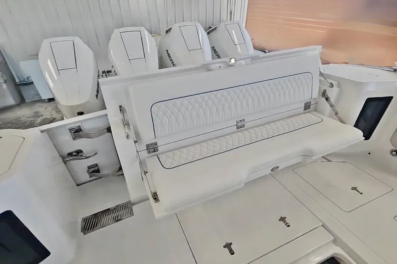 Slide: The Image of Four Mercury outboard engines on a 2025 Intrepid 43 Nomad SE boat. - 7