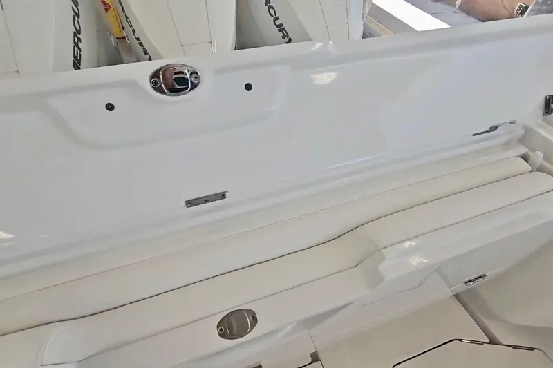 Slide: The Image of 2025 Intrepid 43 Nomad SE with four Mercury outboard engines in a garage setting. - 8