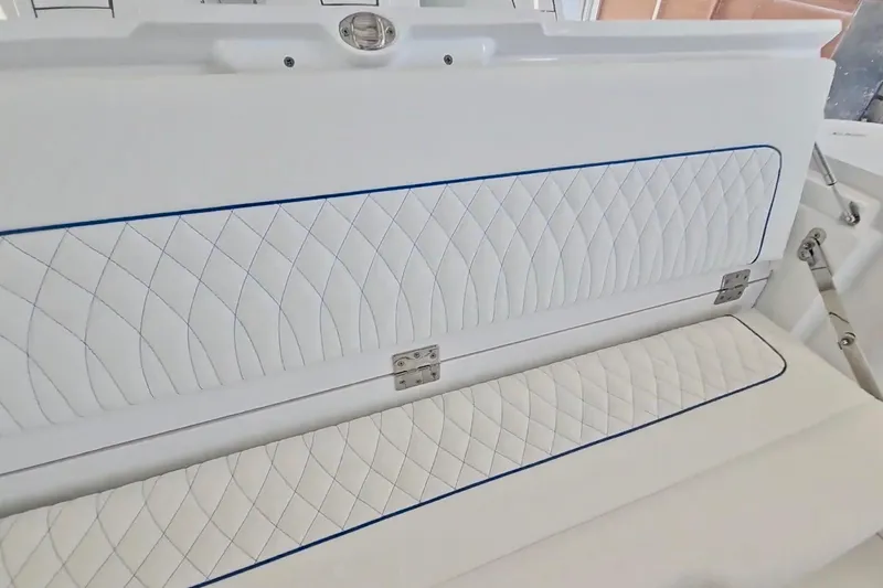 Slide: The Image of 2025 Intrepid 43 Nomad SE boat interior with foldable seating and multiple outboard engines. - 9