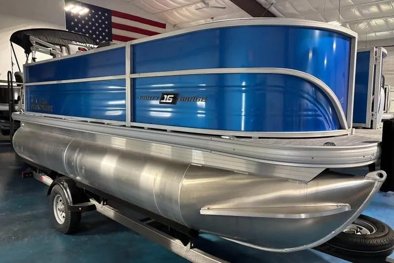 The Image of 2026 Sun Tracker Party Barge 16 DLX pontoon boat in showroom. - 0