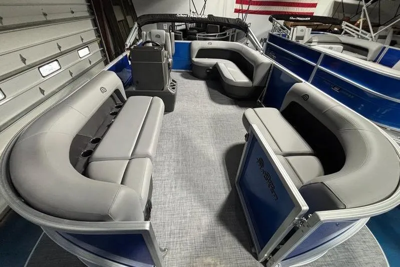 Slide: The Image of 2026 Sun Tracker Party Barge 16 DLX pontoon boat with spacious seating and modern design. - 2