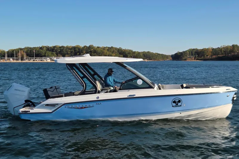 Slide: The Image of 2026 Monterey Elite 27 OB boat with modern seating and sleek design. - 10