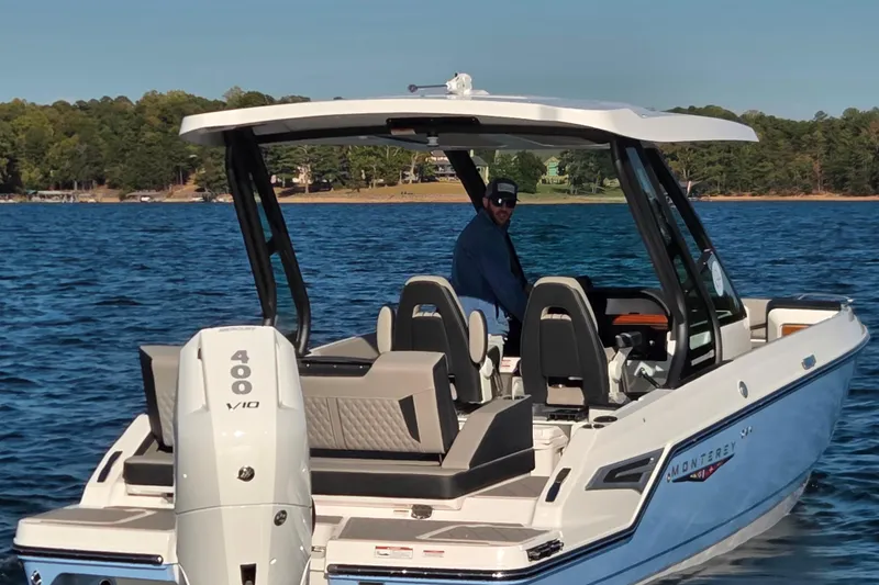 Slide: The Image of 2026 Monterey Elite 27 OB boat interior with sleek seating and modern design. - 12