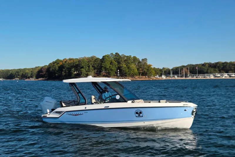 Slide: The Image of 2026 Monterey Elite 27 OB boat with Mercury outboard engine at dock. - 9