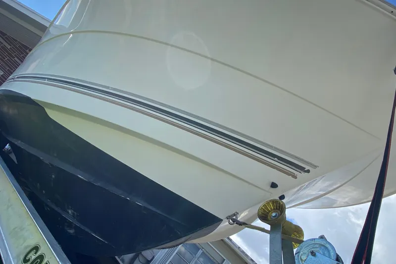 Slide: The Image of 2002 Wellcraft 290 Coastal boat hull on trailer, viewed from below. - 16