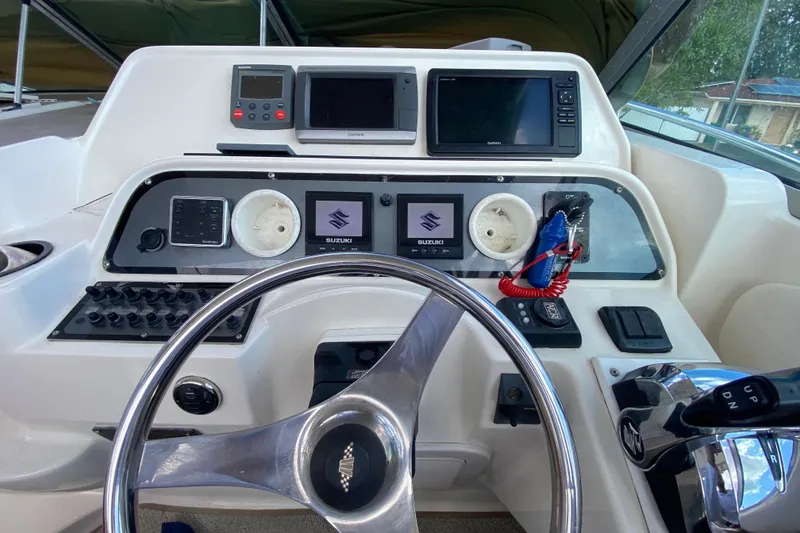 Slide: The Image of Helm of 2002 Wellcraft 290 Coastal boat with steering wheel and navigation instruments. - 27