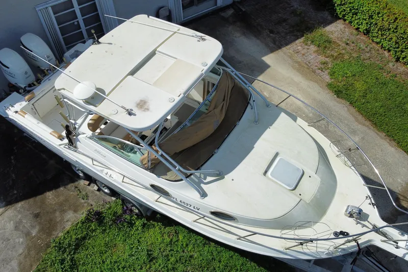 Slide: The Image of 2002 Wellcraft 290 Coastal boat, aerial view, parked on driveway. - 7