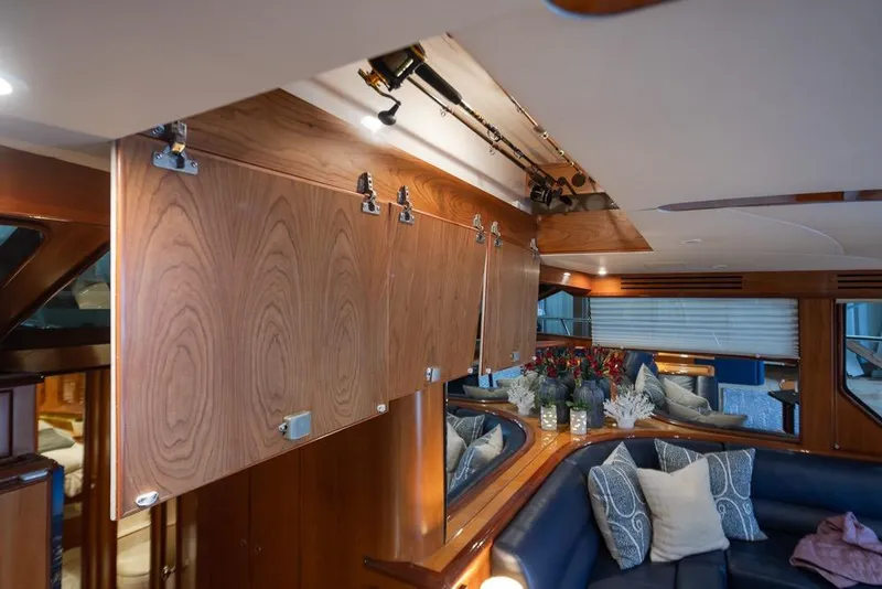 Slide: The Image of Luxurious interior of 2004 Mikelson 50 Sportfisher yacht with wood cabinetry and plush seating. - 10