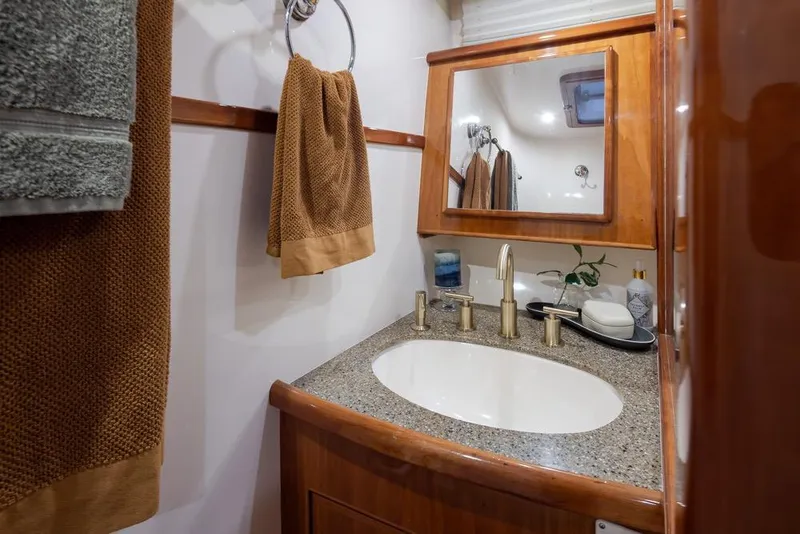 Slide: The Image of Luxurious bathroom in 2004 Mikelson 50 Sportfisher yacht with elegant fixtures and decor. - 24