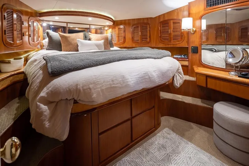 Slide: The Image of Luxurious cabin interior of 2004 Mikelson 50 Sportfisher yacht with elegant wood finishes. - 26