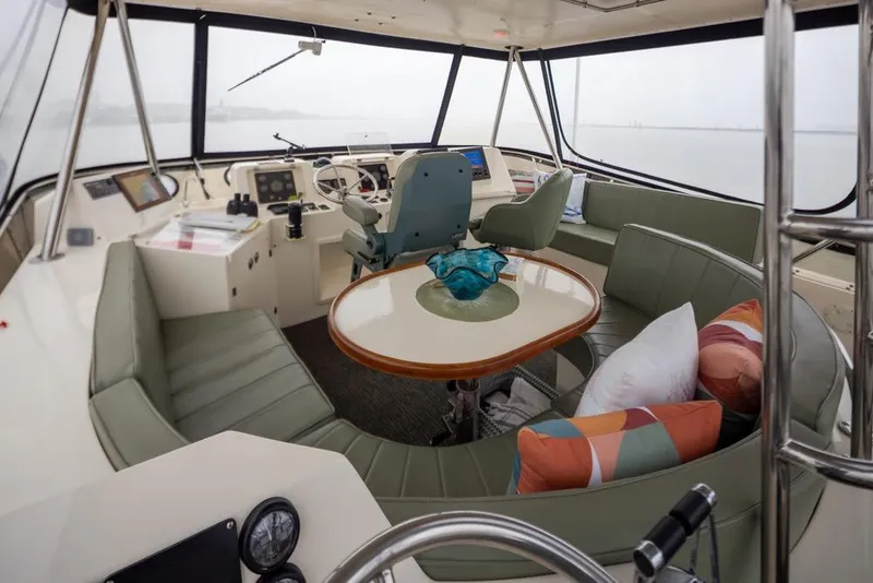 Slide: The Image of Interior of 2004 Mikelson 50 Sportfisher yacht with seating and helm station. - 31