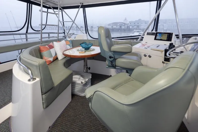 Slide: The Image of Interior of 2004 Mikelson 50 Sportfisher yacht with seating and navigation area. - 35
