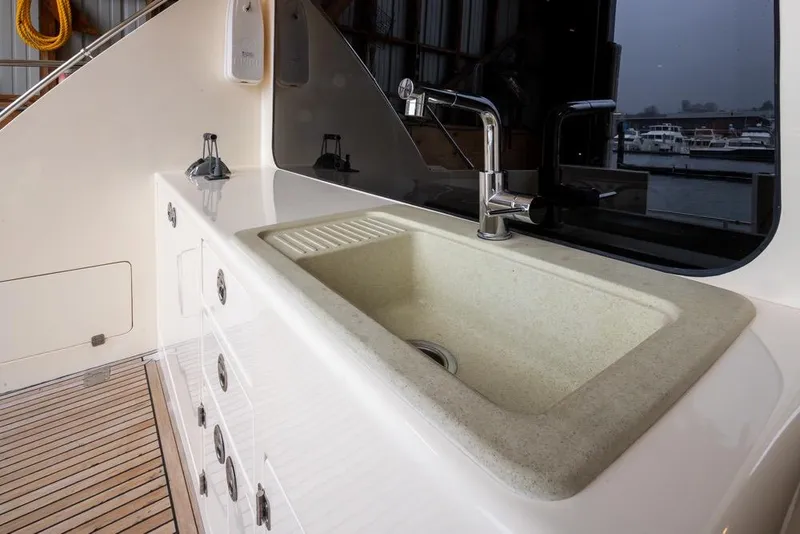 Slide: The Image of Luxury yacht kitchen sink on 2004 Mikelson 50 Sportfisher with modern fixtures. - 42