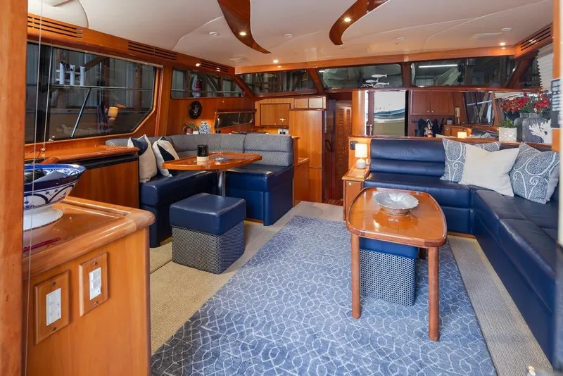 Slide: The Image of Luxurious interior of 2004 Mikelson 50 Sportfisher yacht with elegant seating and decor. - 6