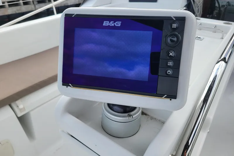 Slide: The Image of B&G navigation display on 2014 Jeanneau 379 sailboat, featuring control buttons. - 11