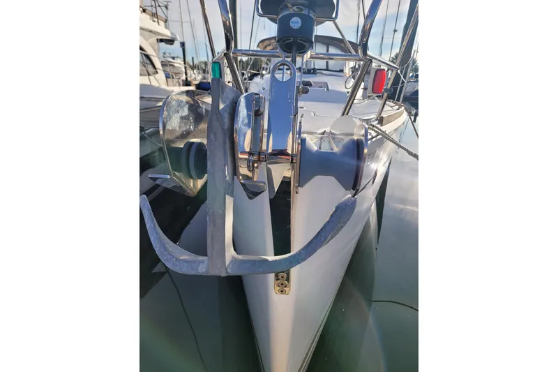Slide: The Image of 2014 Jeanneau 379 sailboat anchor and bow detail in marina setting. - 16