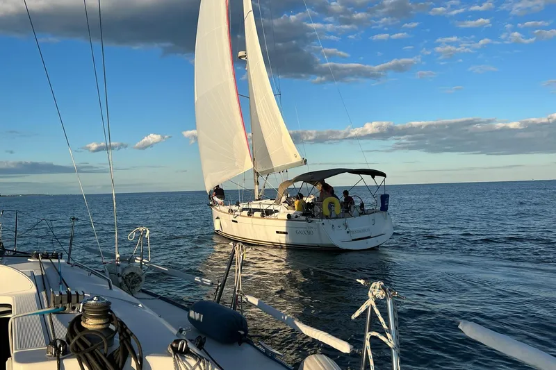 Slide: The Image of Sailboat Jeanneau 379, 2014 model, cruising on calm ocean under blue sky. - 4