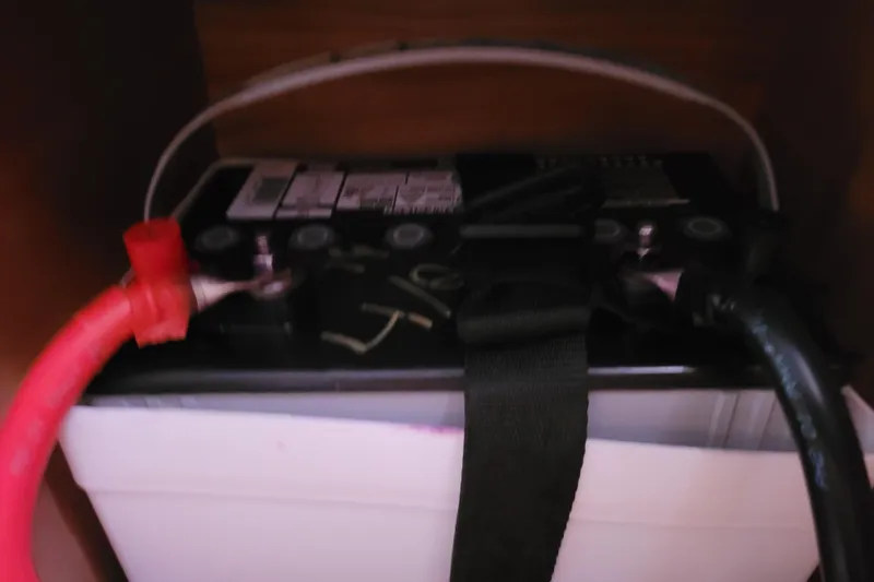 Slide: The Image of Battery compartment of a 2014 Jeanneau 379 sailboat with connected cables. - 51
