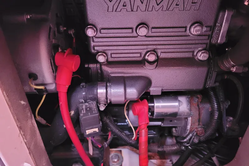 Slide: The Image of Engine compartment of a 2014 Jeanneau 379 sailboat with visible Yanmar components. - 56