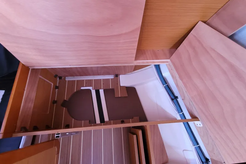 Slide: The Image of Interior view of 2014 Jeanneau 379 sailboat, featuring wooden cabinetry and flooring. - 63