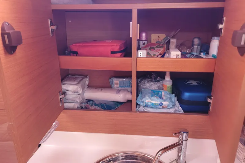Slide: The Image of Cabinet with toiletries and supplies on a 2014 Jeanneau 379 sailboat. - 68
