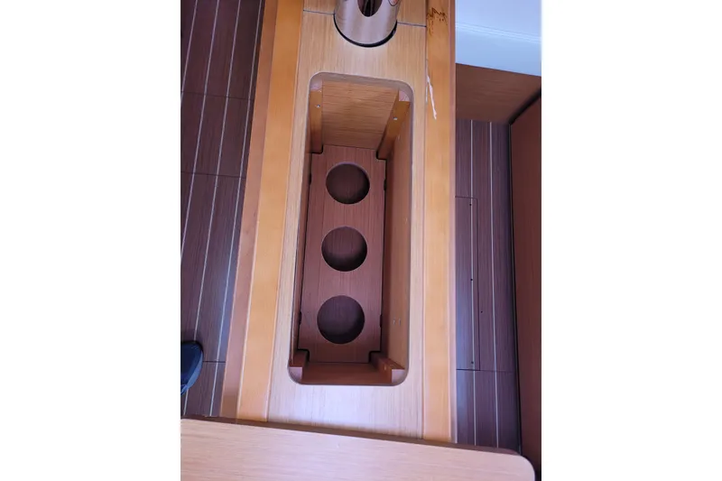 Slide: The Image of Interior view of 2014 Jeanneau 379 sailboat with wooden flooring and storage compartment. - 71