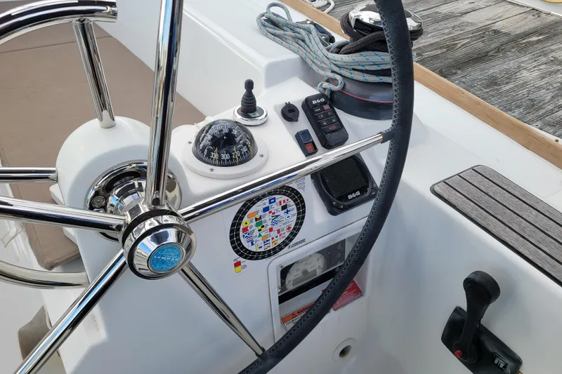 Slide: The Image of Steering wheel and controls of a 2014 Jeanneau 379 sailboat cockpit. - 8