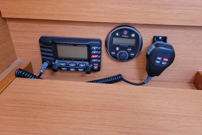 Slide: The Image of 2014 Jeanneau 379 yacht communication and audio controls on wooden panel. - 35