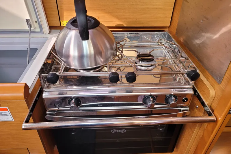 Slide: The Image of Stainless steel stove with kettle in 2014 Jeanneau 379 yacht kitchen. - 38