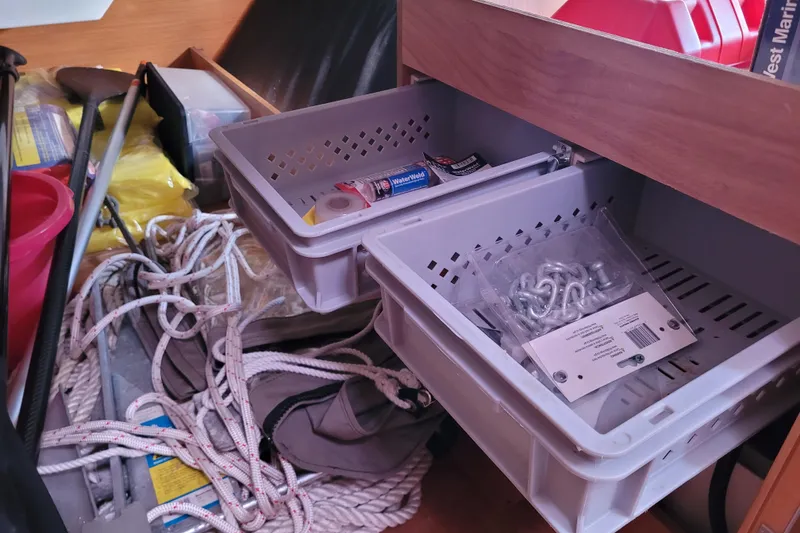 Slide: The Image of Storage area on a 2014 Jeanneau 379 sailboat with ropes and marine supplies. - 49