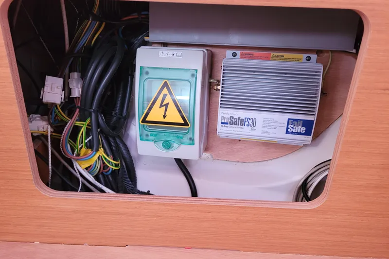Slide: The Image of Electrical panel and wiring inside a 2014 Jeanneau 379 sailboat. - 58