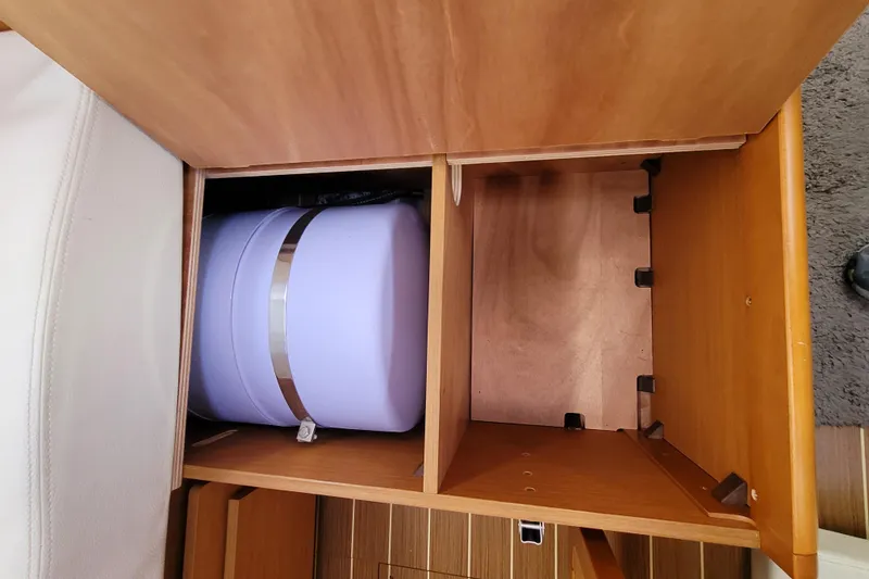 Slide: The Image of Wooden storage compartment in a 2014 Jeanneau 379 sailboat interior. - 64