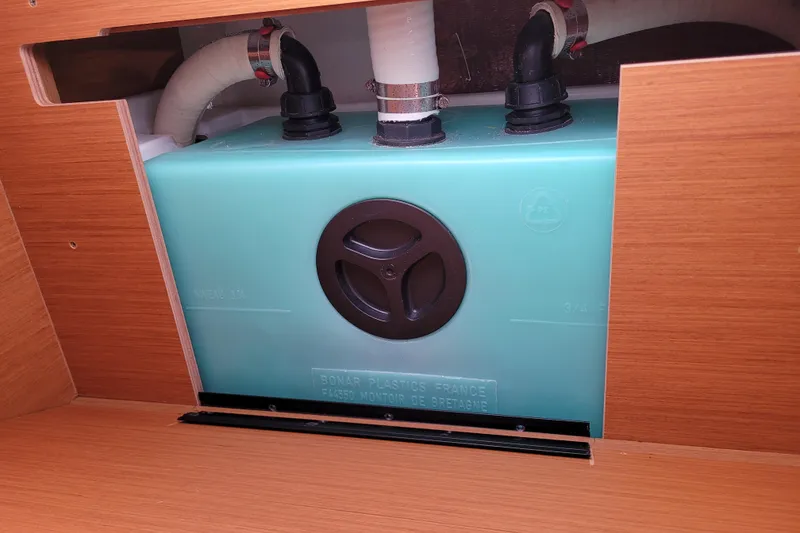 Slide: The Image of 2014 Jeanneau 379 water tank system with visible pipes and fittings. - 69