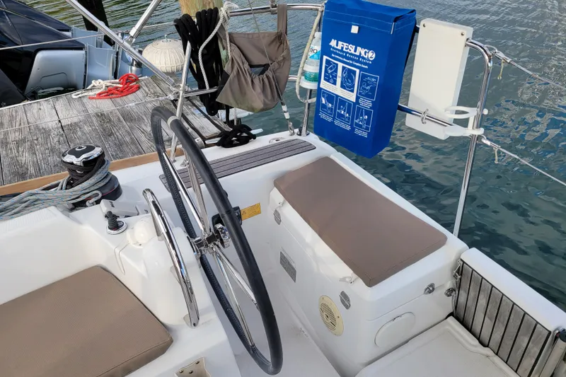 Slide: The Image of Cockpit of 2014 Jeanneau 379 sailboat with steering wheel and safety equipment. - 7