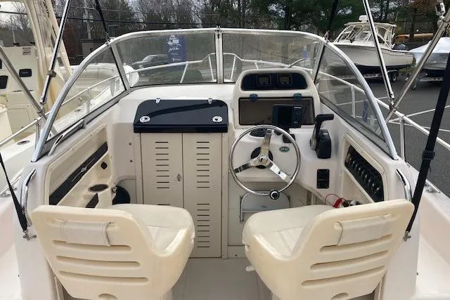 Slide: The Image of 2012 Grady-White Adventure 208 boat cockpit with dual seats and steering wheel. - 5