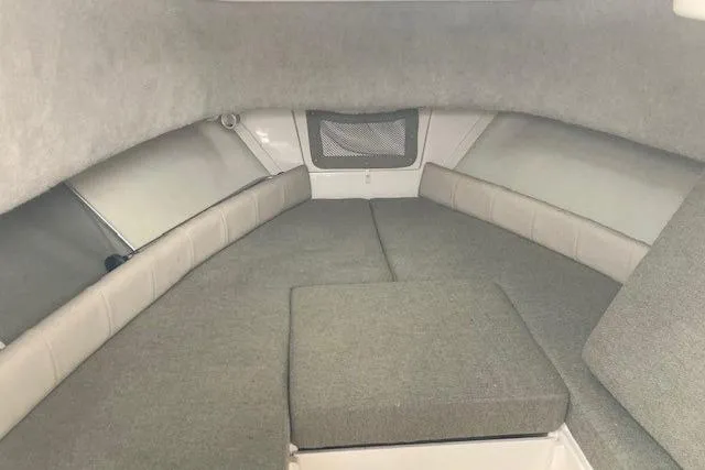 Slide: The Image of Interior cabin of 2012 Grady-White Adventure 208 boat, featuring cushioned seating. - 9