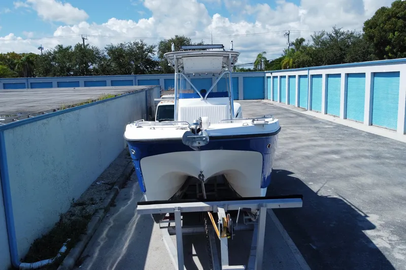 Slide: The Image of 2002 ProKat 2660 Center Console boat on trailer in storage facility. - 16