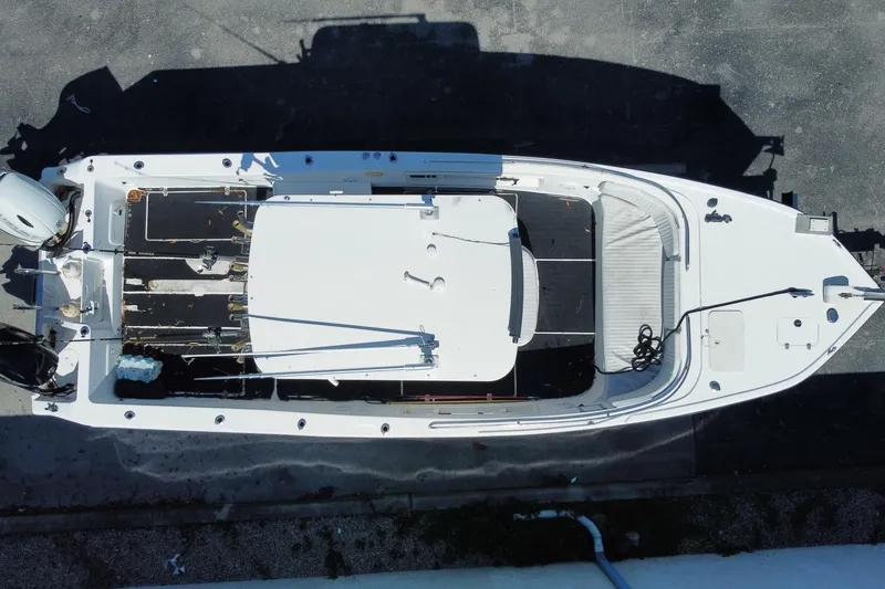 Slide: The Image of Overhead view of 2002 ProKat 2660 Center Console boat on pavement. - 23