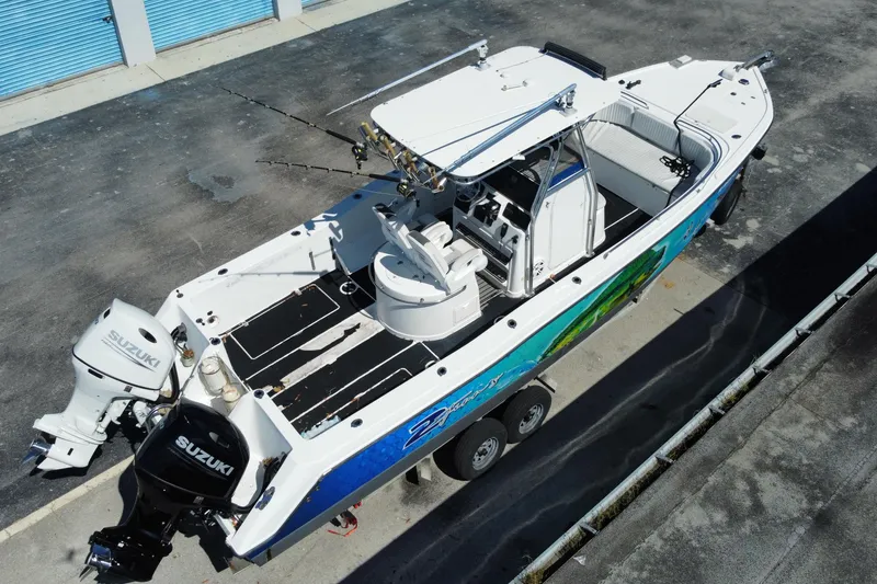 Slide: The Image of 2002 ProKat 2660 Center Console boat with Suzuki engines, aerial view. - 27