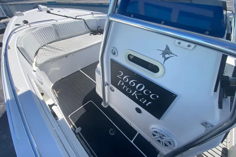 Slide: The Image of 2002 ProKat 2660 Center Console boat with white seating and sleek design. - 35
