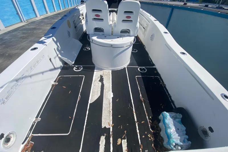 Slide: The Image of 2002 ProKat 2660 Center Console boat interior with seating and storage compartments. - 38