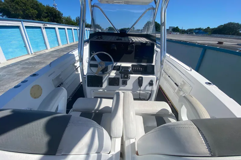 Slide: The Image of 2002 ProKat 2660 Center Console boat interior with steering wheel and controls. - 40