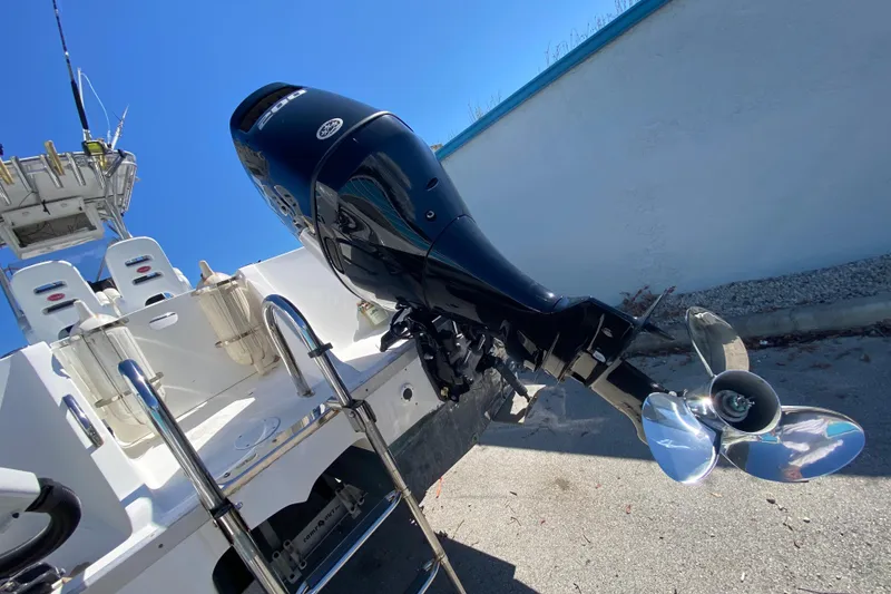 Slide: The Image of 2002 ProKat 2660 Center Console boat with powerful outboard motor and stainless steel propeller. - 50