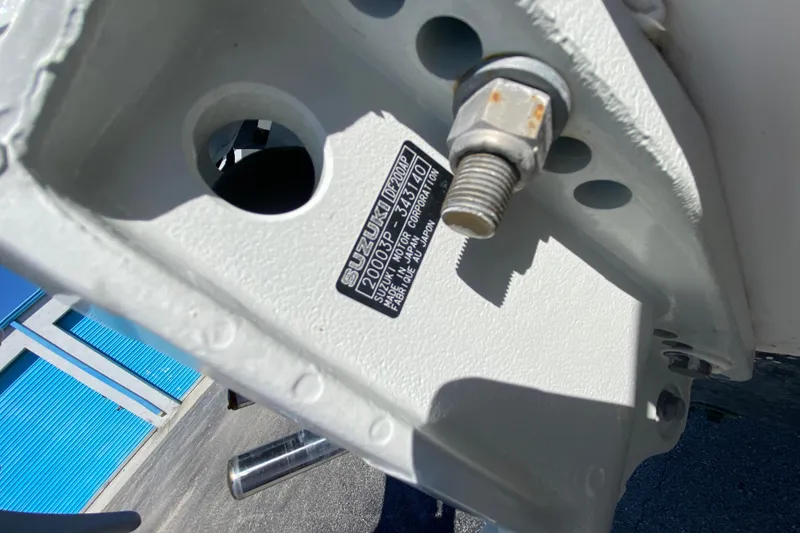 Slide: The Image of Close-up of a 2002 ProKat 2660 Center Console boat engine mount with Suzuki label. - 54